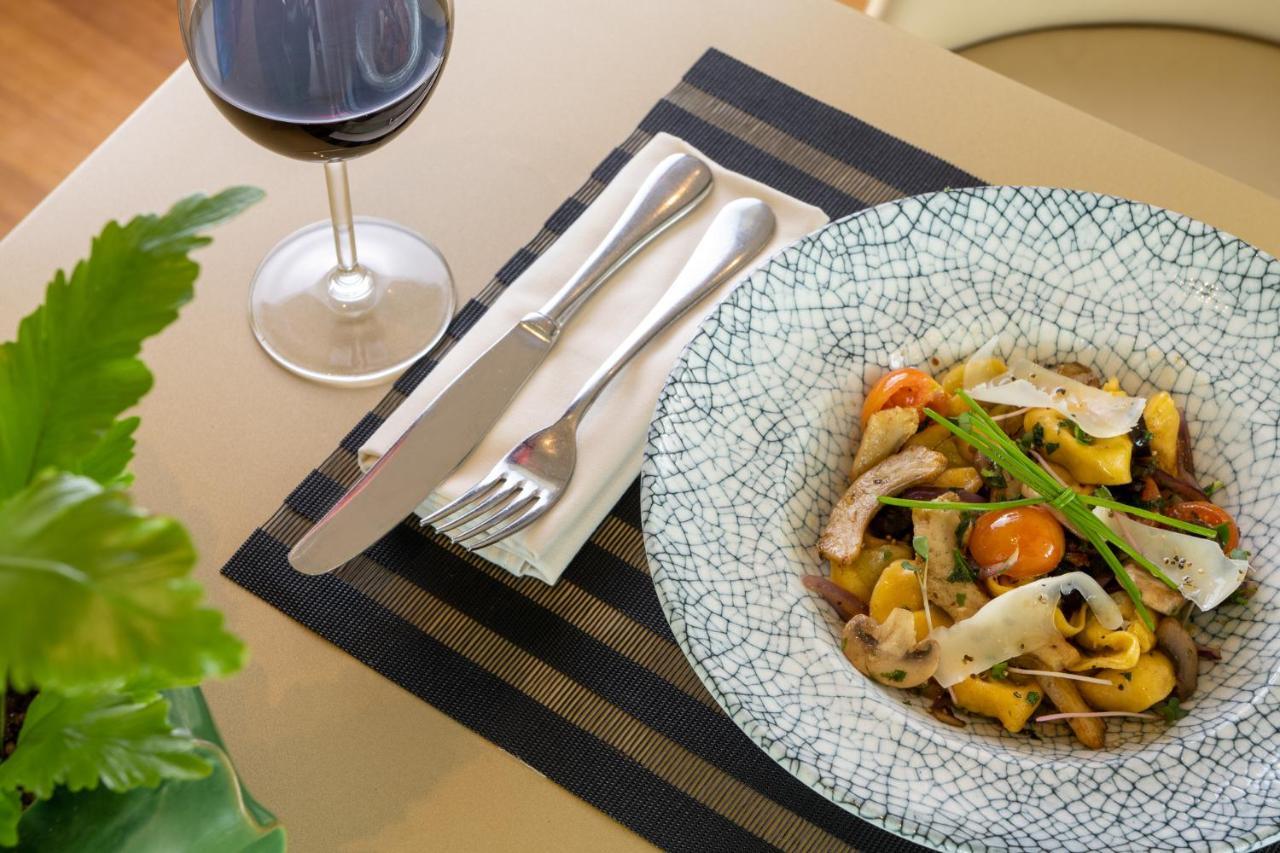 Vert Lagoon Netanya By Afi Hotels Exterior photo A place setting with a wine glass, a plate of food, and a place mat
